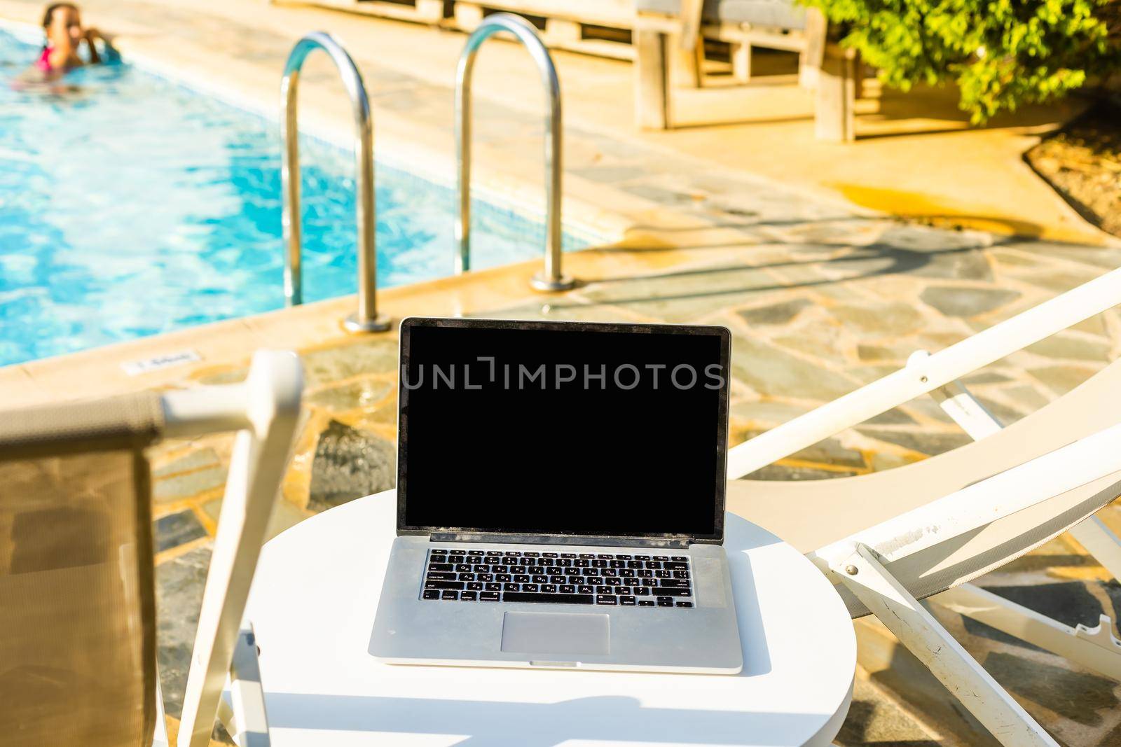 computer on table background as a pool.