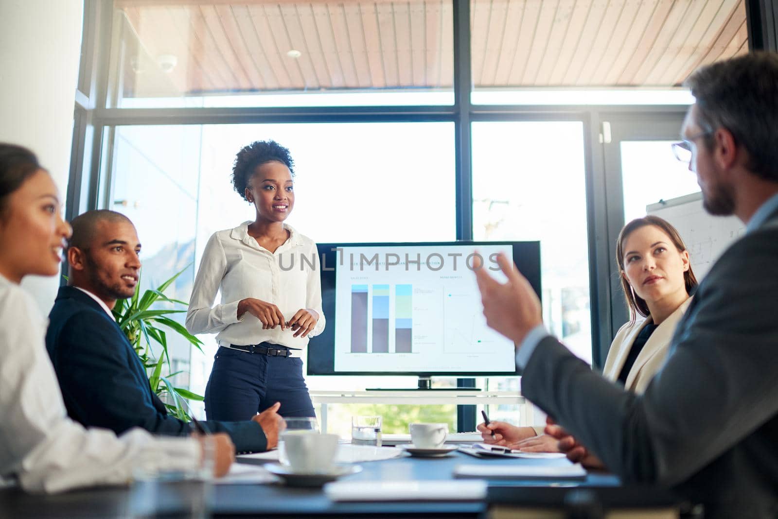 Sharing some of their big ideas. Cropped shot of a group of business colleagues meeting in the boardroom. by YuriArcurs