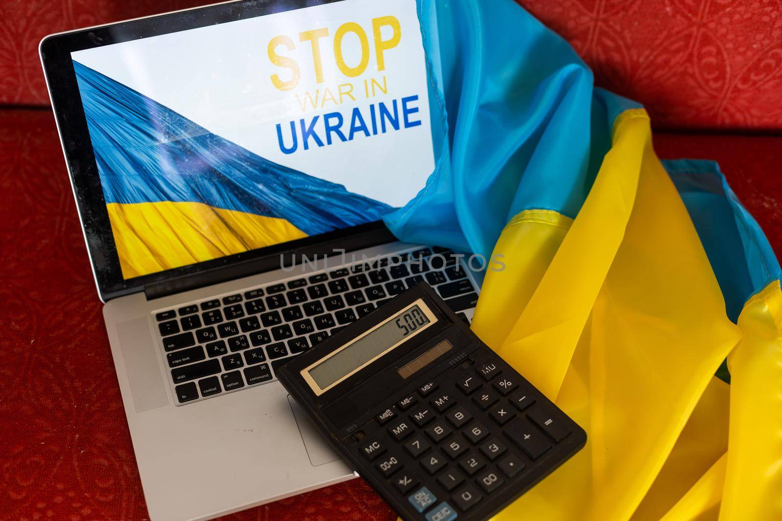 stop war and patriot. laptop, flag of ukraine.