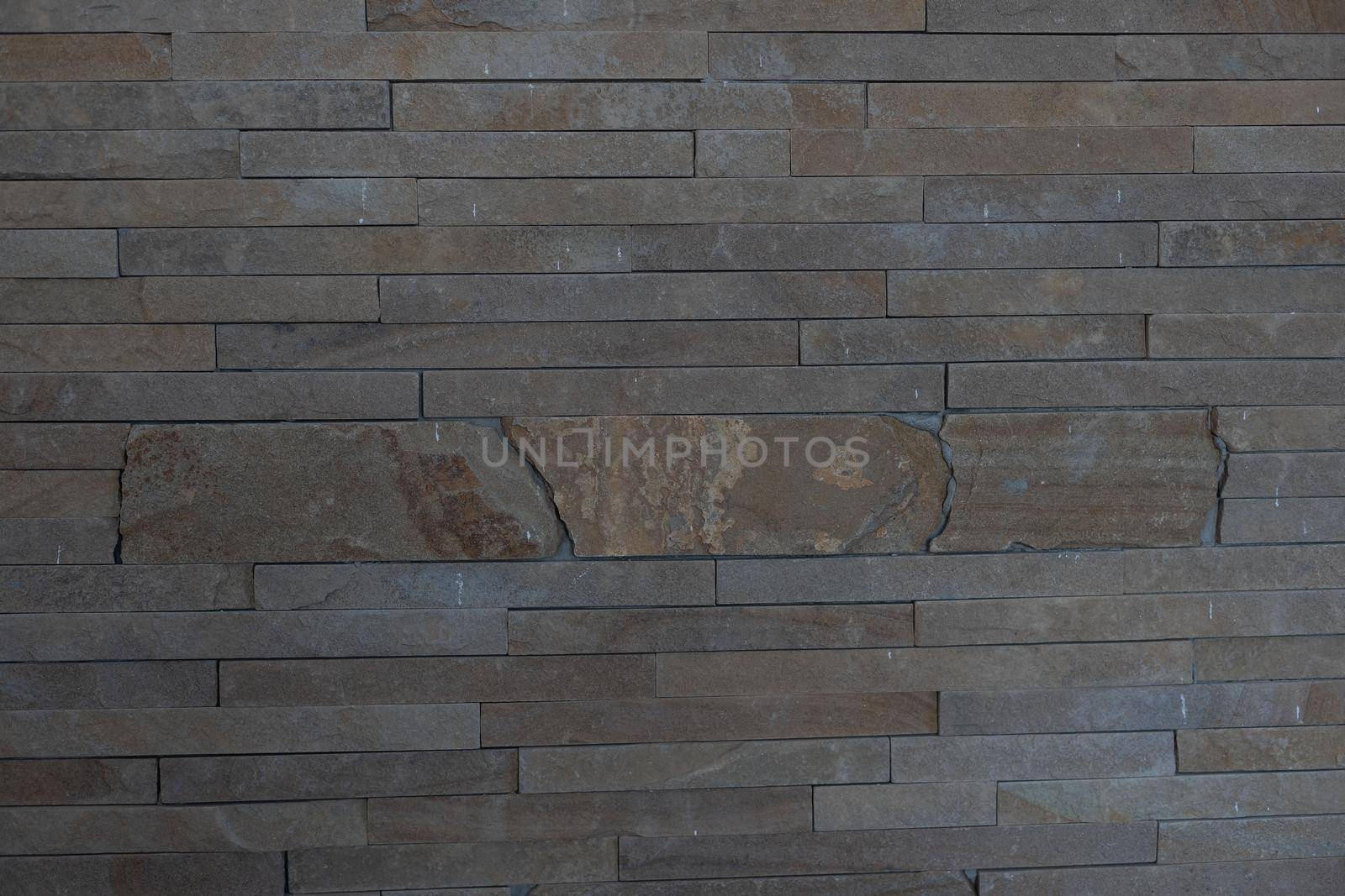 Elegant stone cladding wall made of gray granite with different shades by Andelov13