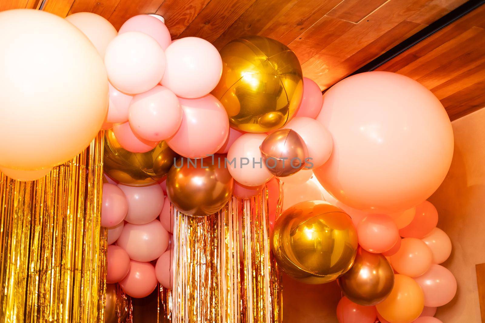 Stylish metallic pink balloons for Valentine's day, hen party or baby shower on a white background by Andelov13
