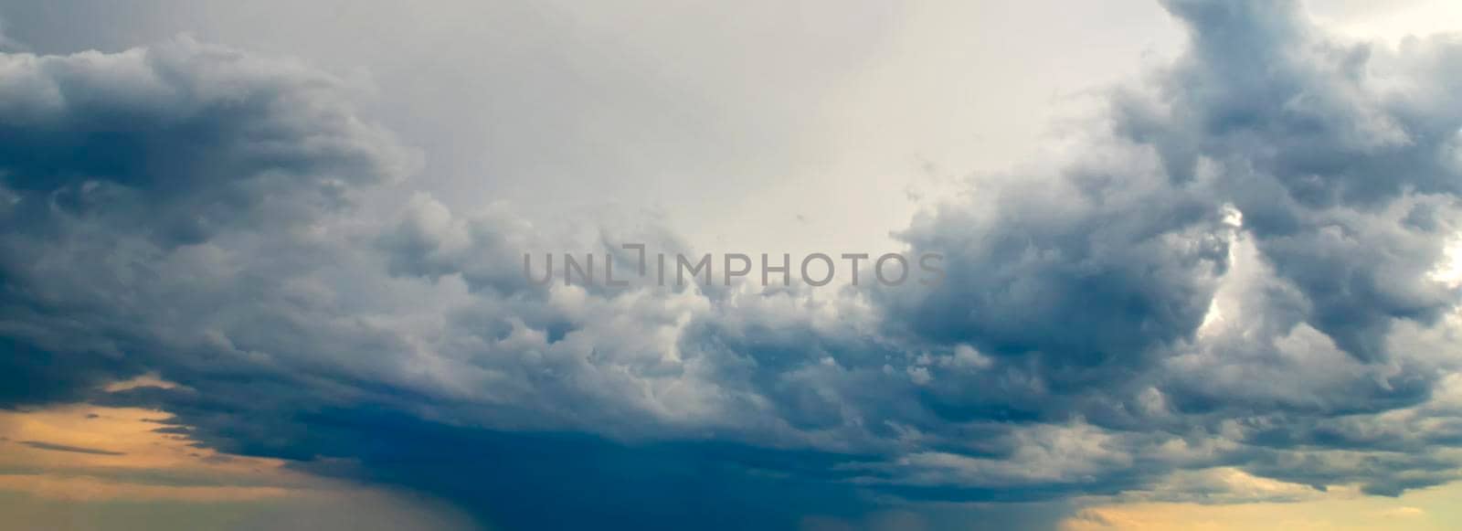 Amazing stormy clouds over the city. Panoramic view by EdVal