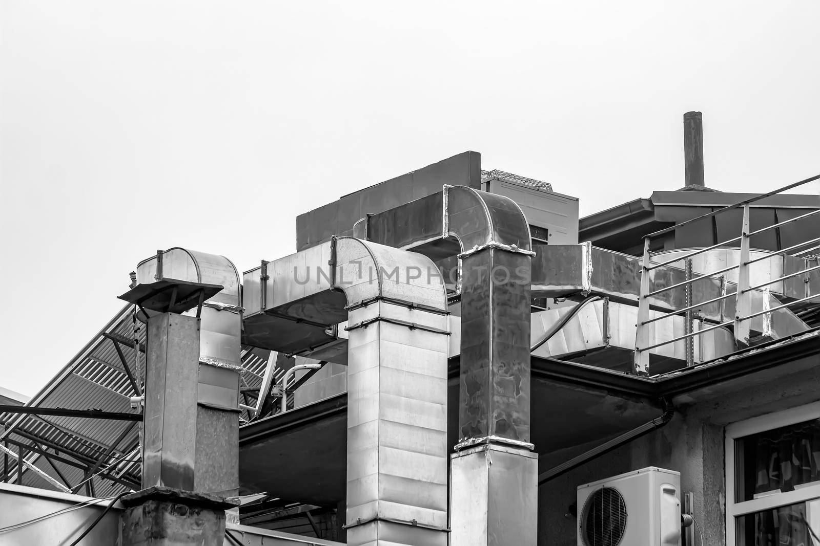 air ventilation flow system on the roof of the building. vent pipe fan HVAC. Black and white