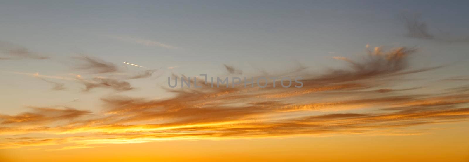 Beauty orange clouds in the sky. Panoramic view