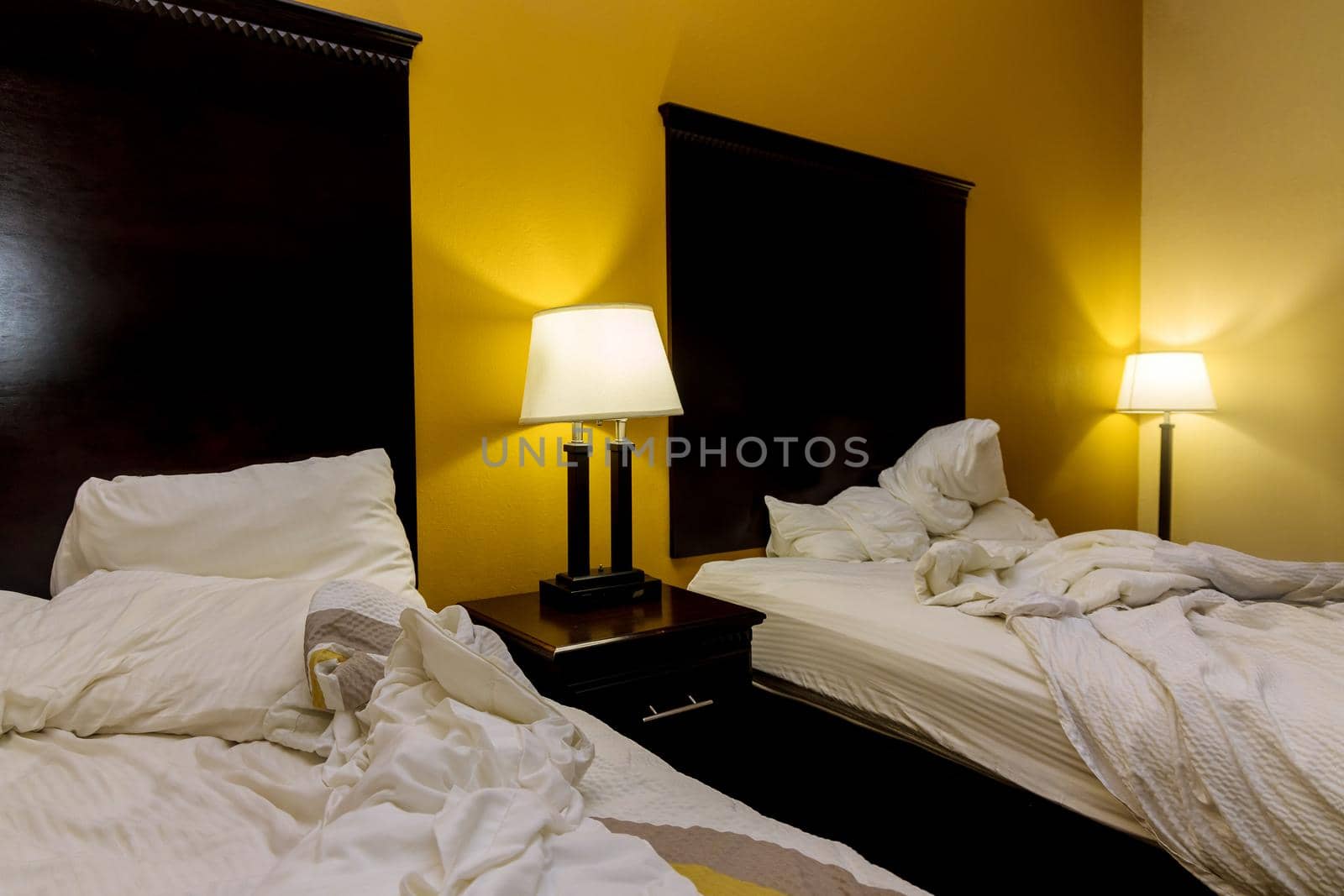 Double bed hotel room interior by ungvar