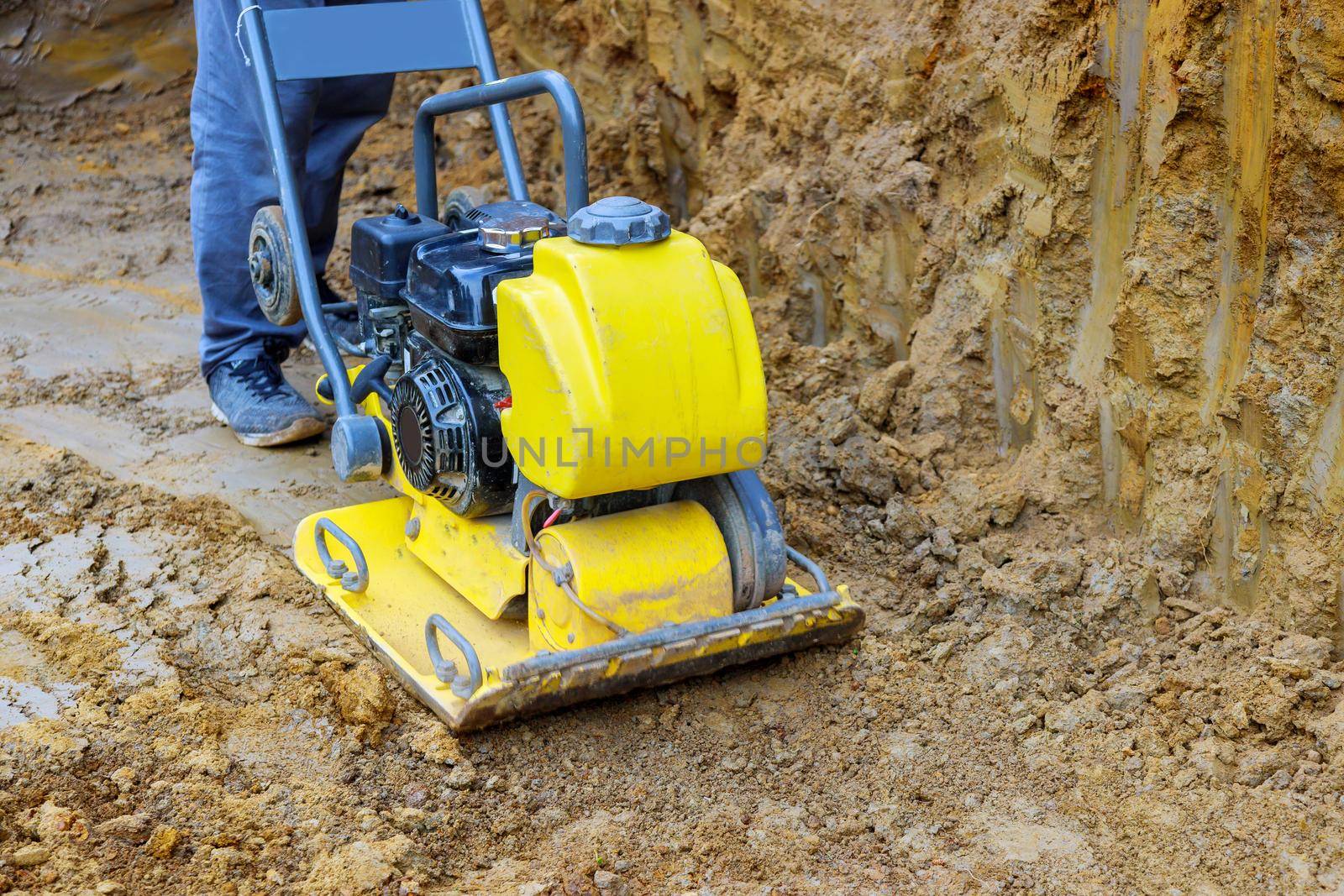 Construction machinery for soil compactor during construction site work.
