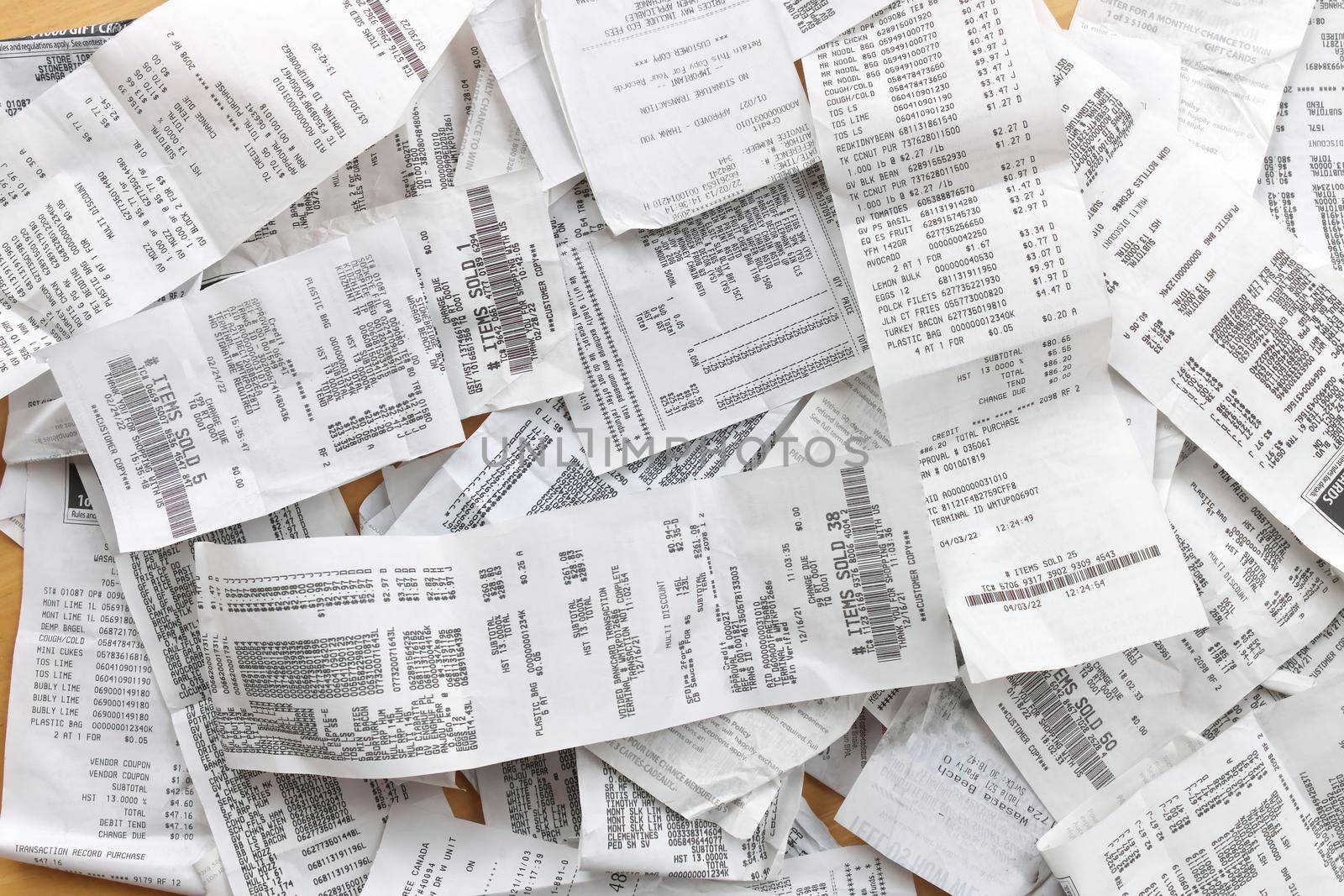 Directly Overhead Flatlay Full Frame Image of Receipts Ready for Accounting, Bookkeeping, Tax, Filing, Budgeting by markvandam