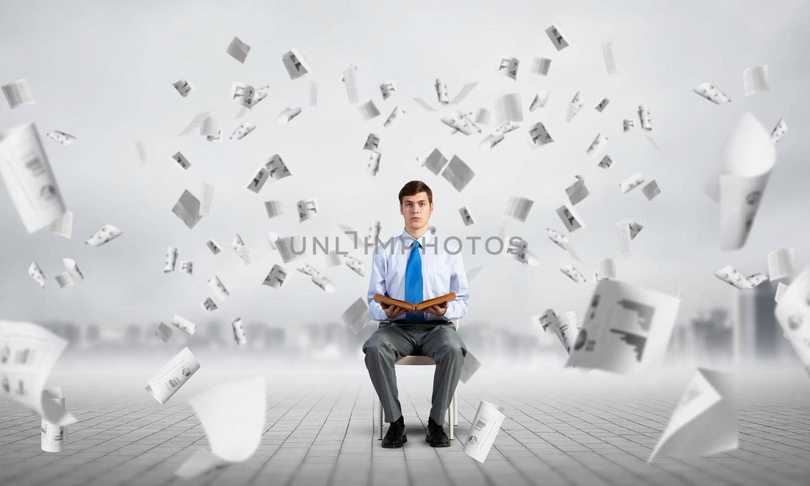 young businessman with book by adam121
