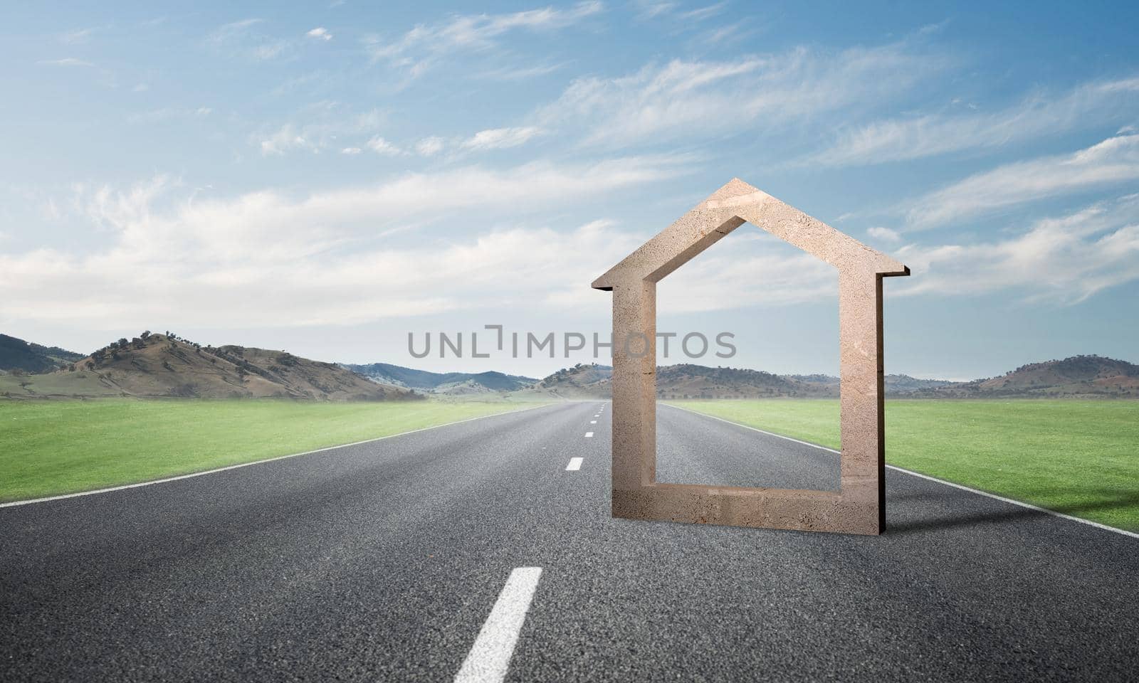 Conceptual background image of concrete home sign on asphalt road by adam121