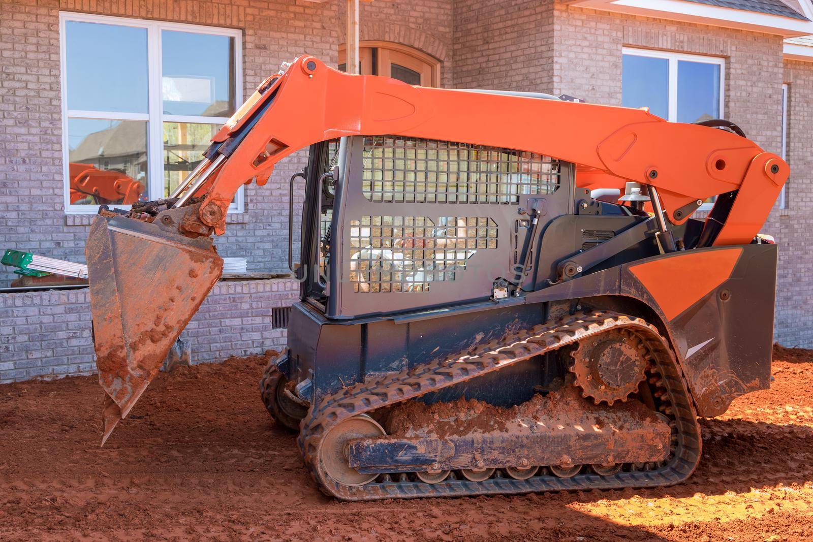 Moving ground in bulldozer with performing landscaping by ungvar