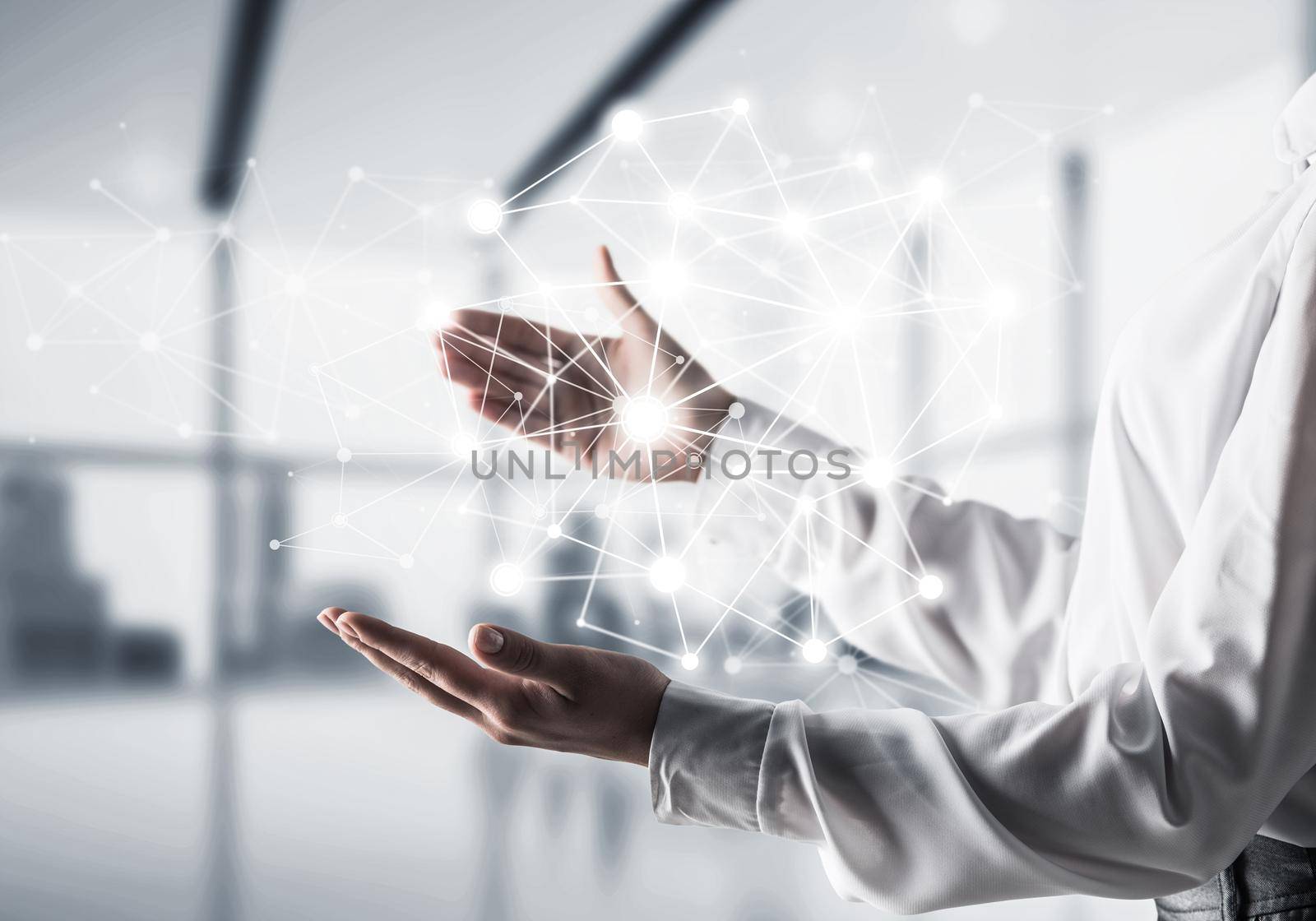 Business woman in shirt keeping white social media network structure in hands with office view on background. Mixed media.