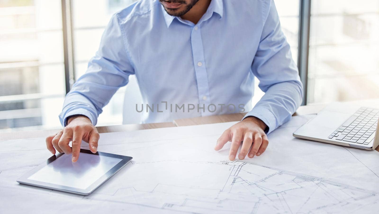 Shot of an unrecognizable businessperson working in an office.