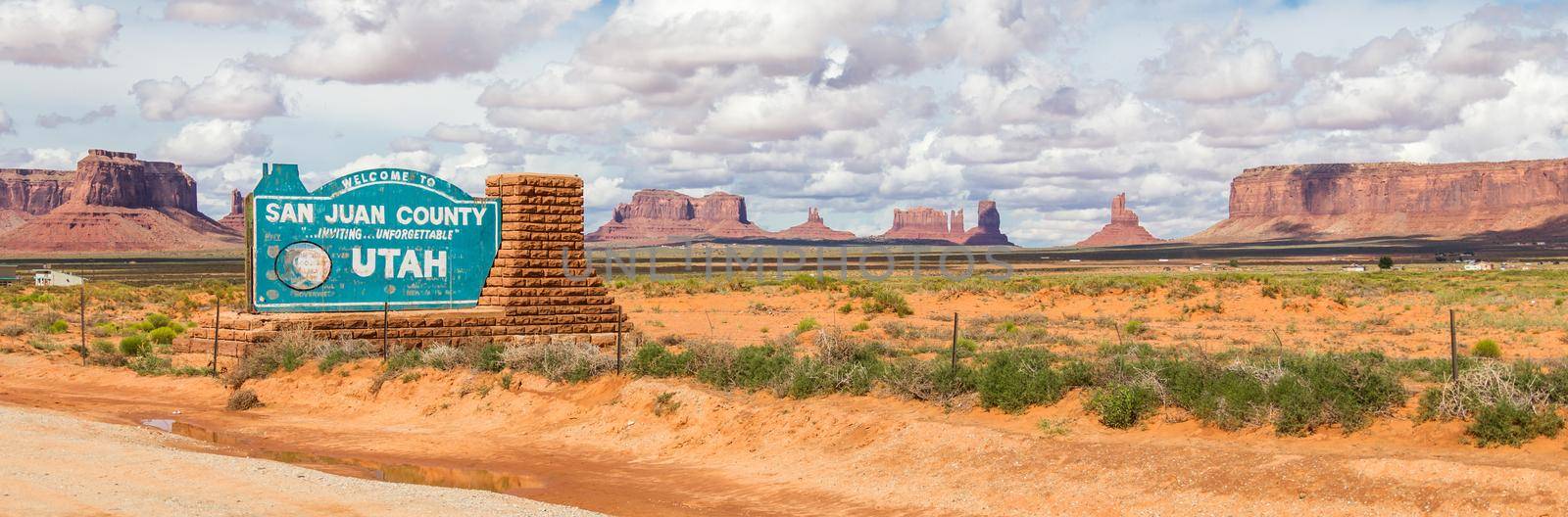 Welcome sign in desert for San Juan County in Monument Valley in Utah. by Mariakray