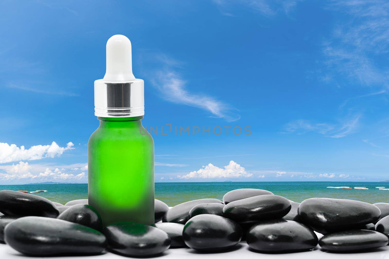 Serum oil bottle dropper mock up or essential oil with blue sky background