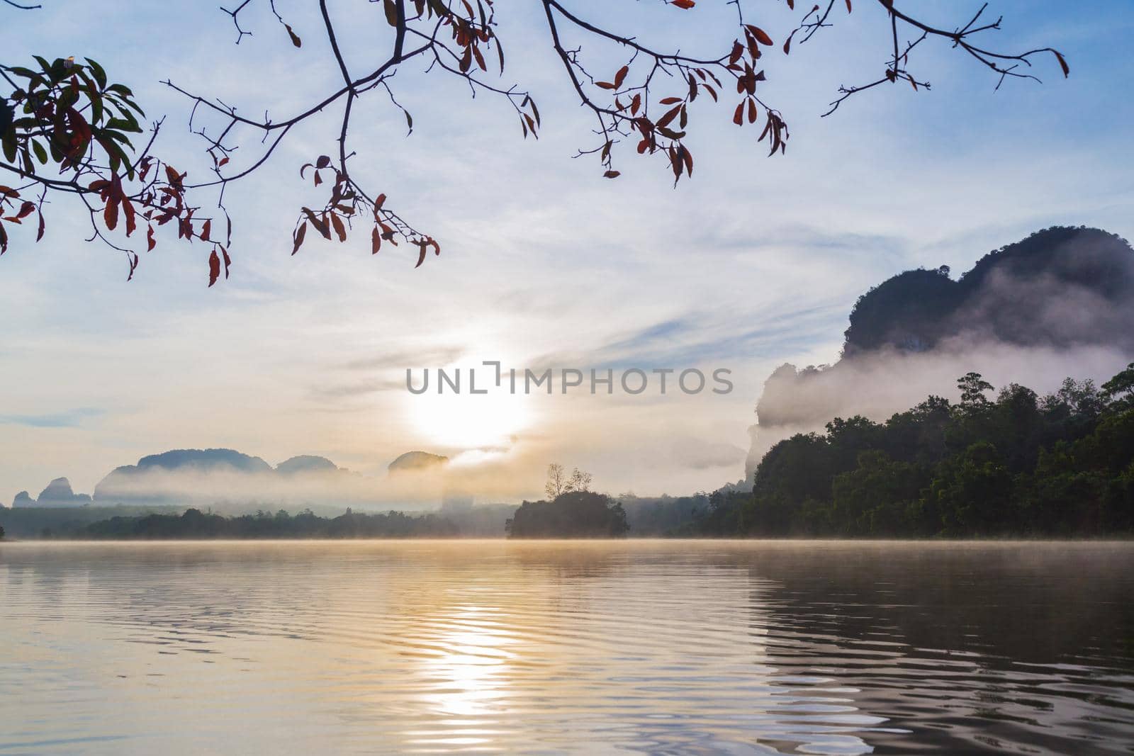 Ban Nong Thale the natural scenery of the sunshine in the morning (mountains, lakes, trees, fog) at Krabi, Thailand.