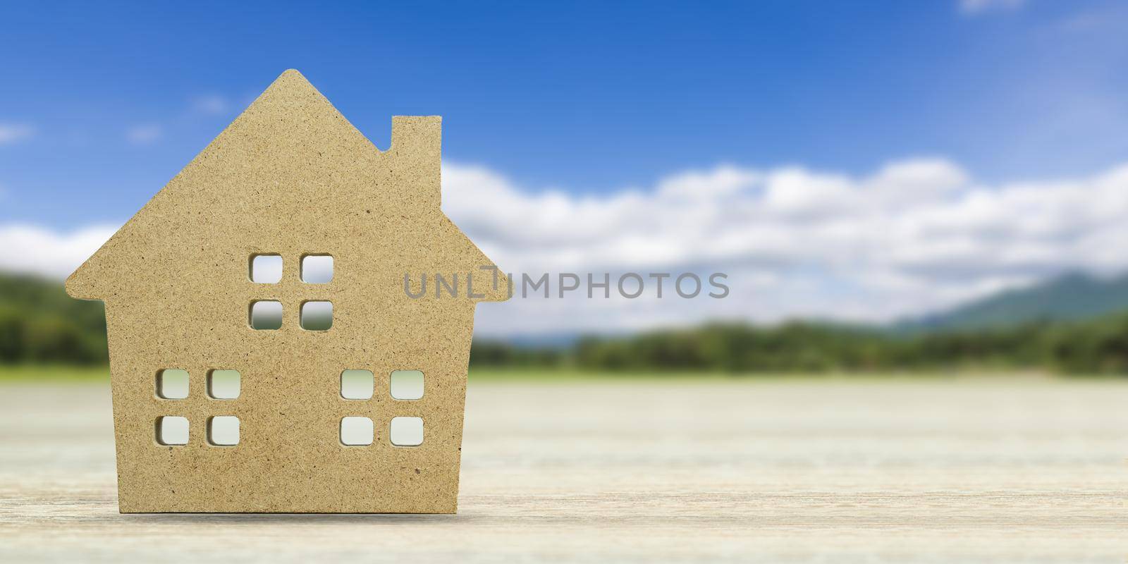 House model with landscape back background for finance and banking concept