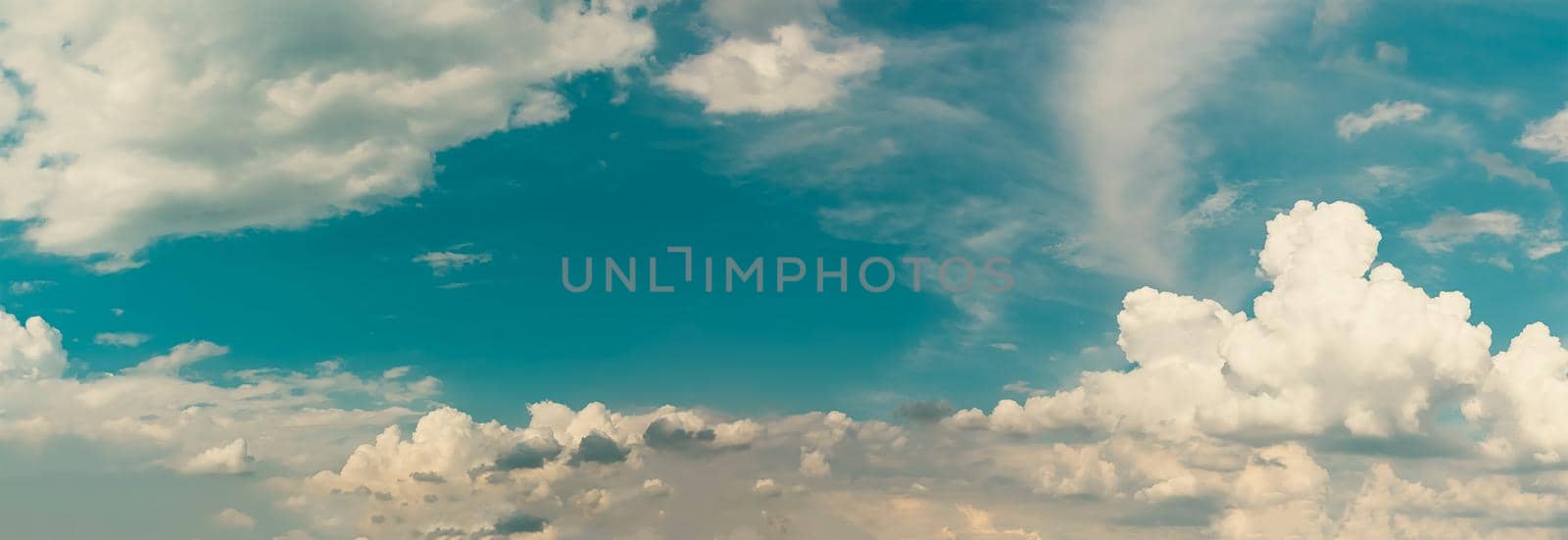 Summer cloud sky panorama with fleece clouds, Vibrant color panoramic sky with cloud on a sunny day