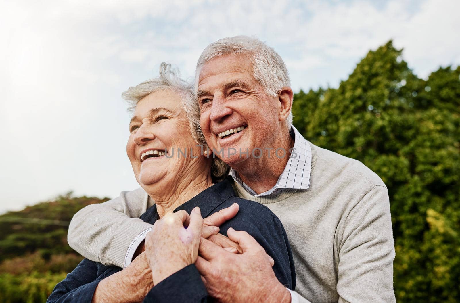 The retired years are the happy years. Shot of a happy senior couple spending time together outdoors. by YuriArcurs