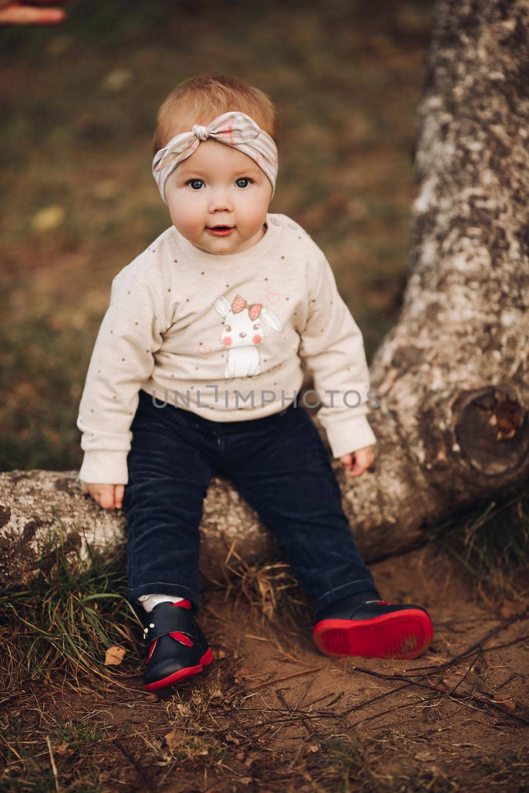 Adorable baby girl in headband with bow and bunny on jersey. by StudioLucky