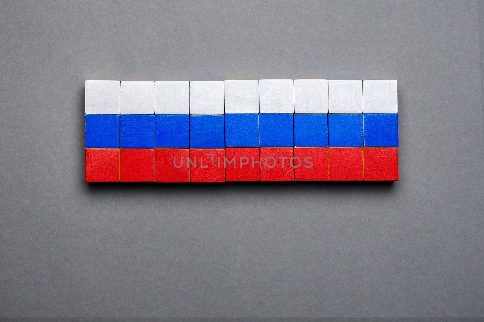 Isolated block toy wood cube made flag of Russia design background flag concept. Wooden block background Russian banner design national flag symbolic Russia symbol national banner background RU sign