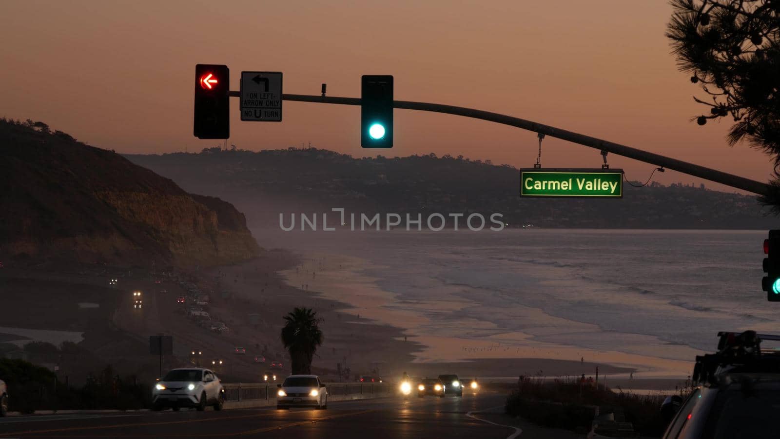 Traffic lights, pacific coast highway, California. Road trip along ocean in dusk by DogoraSun