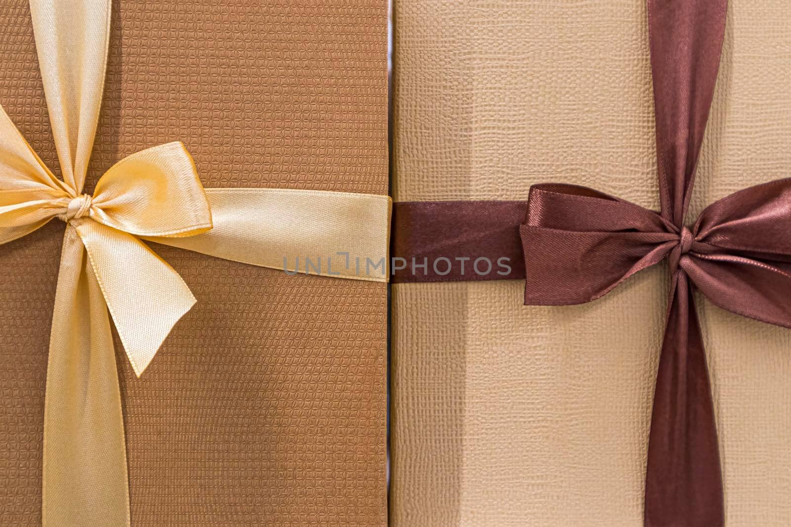 festive multicolored boxes with ribbons large as background. photo