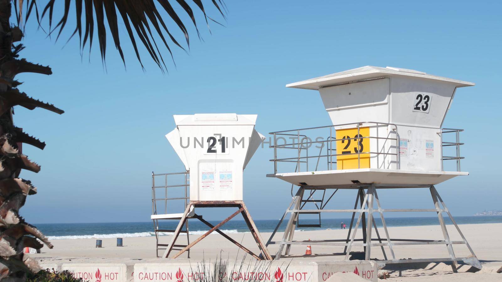 Lifeguard stand and palm tree, life guard tower for surfing on California beach. by DogoraSun