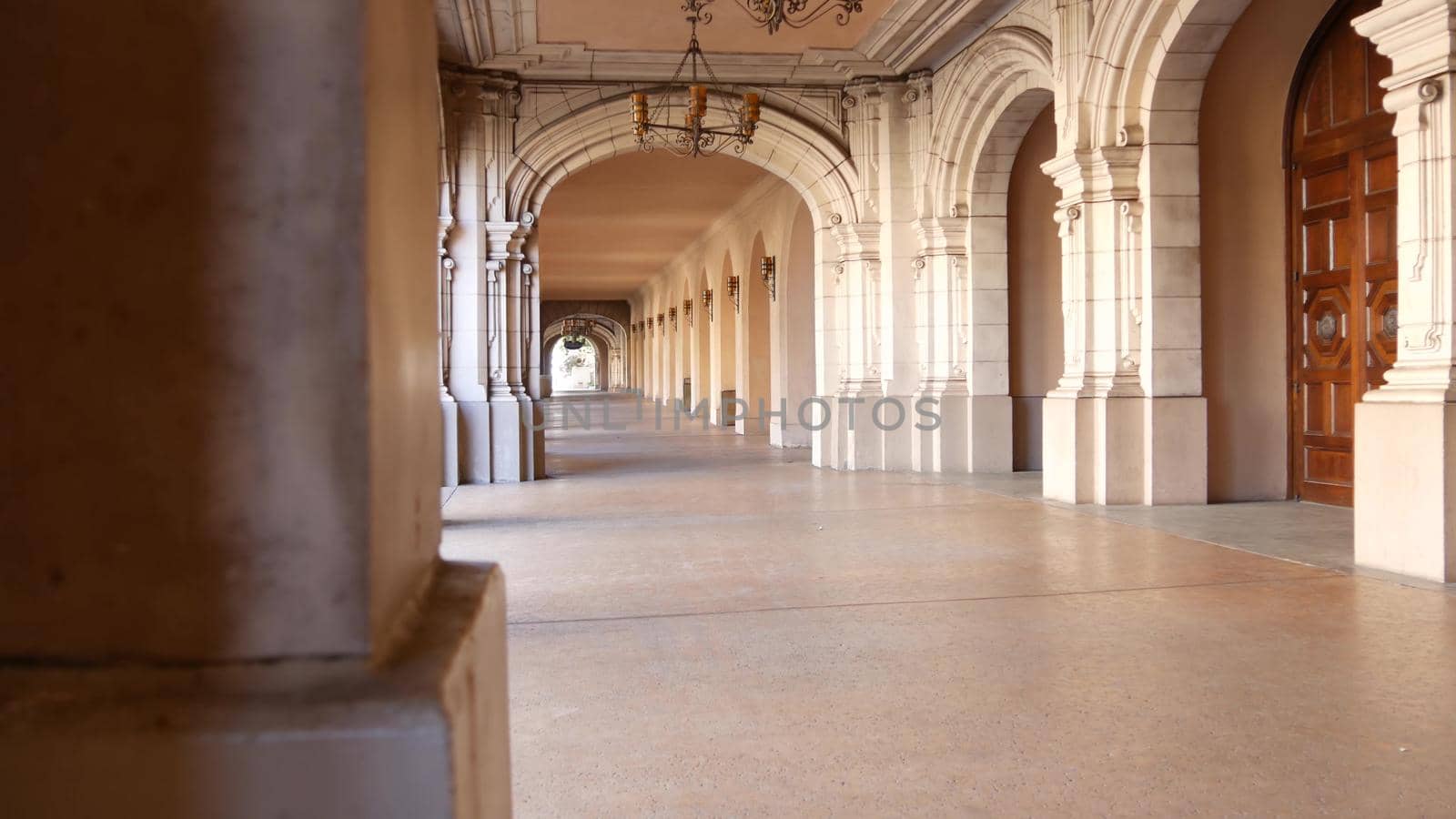 Spanish colonial revival architecture, Balboa Park, San Diego, California USA. Historic building, classic baroque or rococo romance style. Arches and columns of Casa, archway, vault, arcade or passage