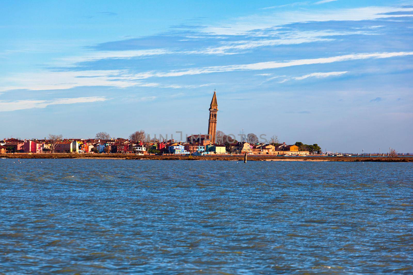 View of the Leaning Bell Tower of the Church of San Martino in Burano Island - Venice Italy