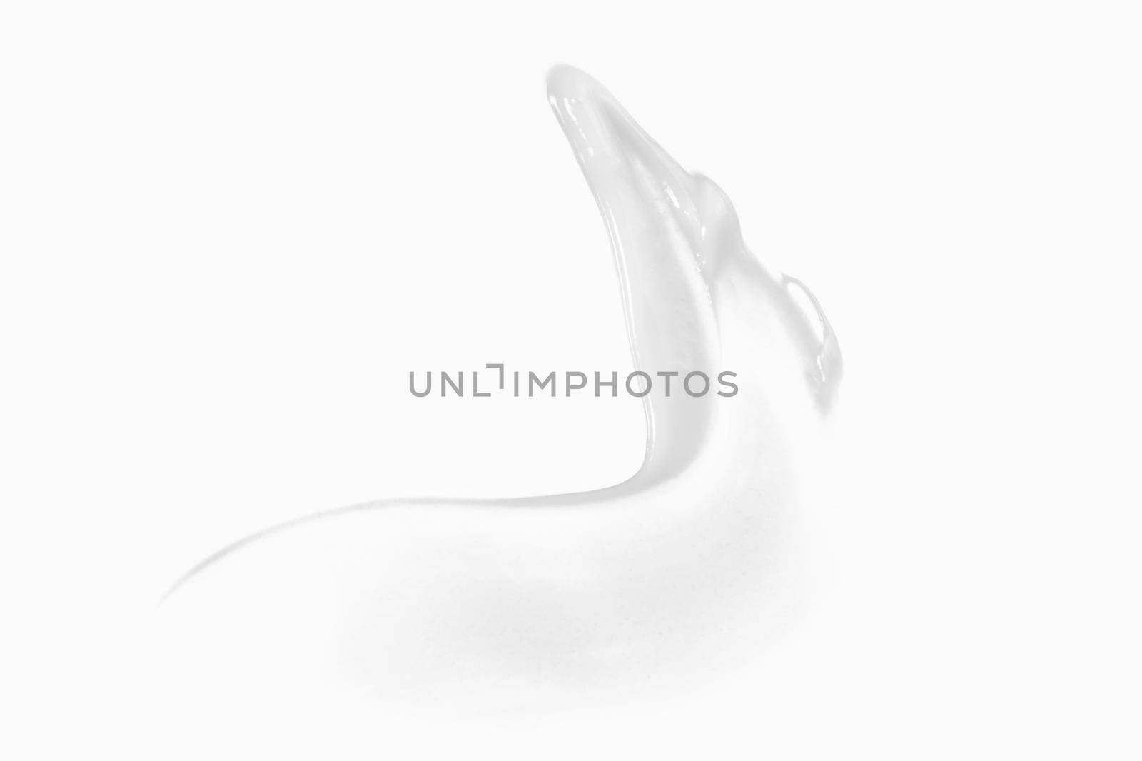 White cream swipe isolated on white. Foundation texture, lotion smudge, moisturizer sample. by photolime