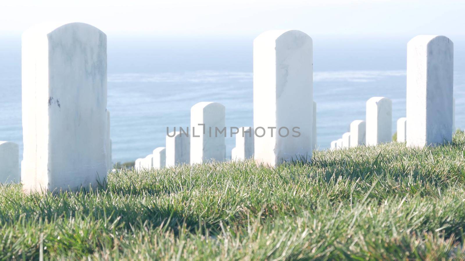 Tombstones on american military national memorial cemetery, graveyard in USA. by DogoraSun