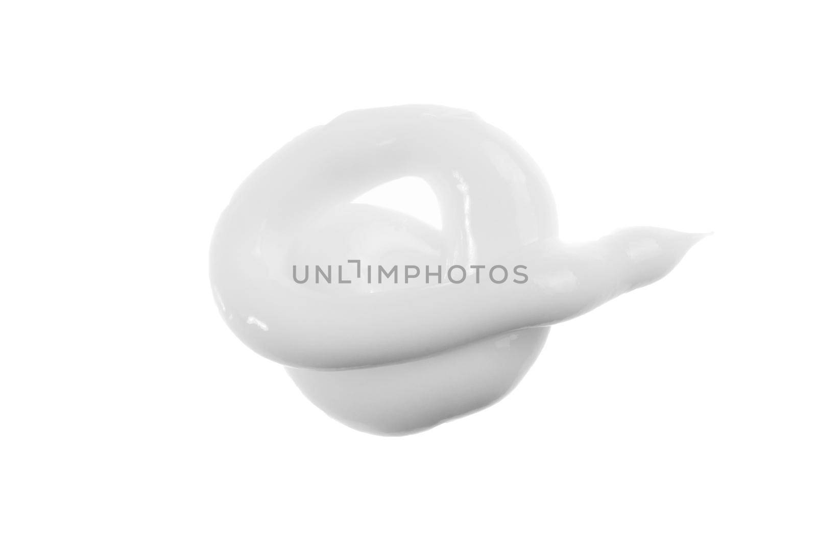 White face cream swirl isolated on white. Foundation texture, lotion smudge, moisturizer sample