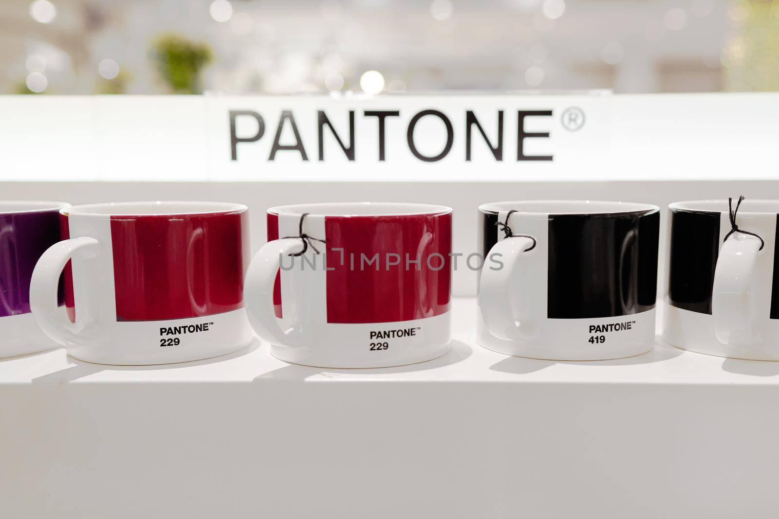 Milan, Italy - December 15, 2020: Pantone mug on a white shelf by photolime