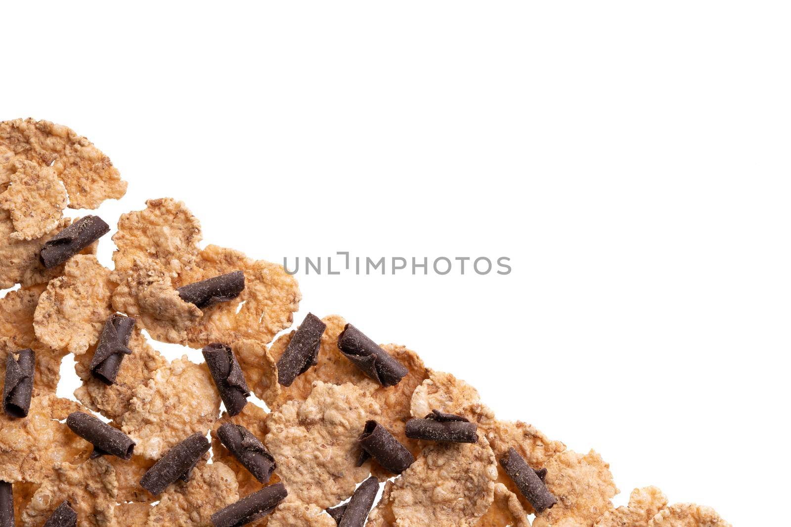 Tasty homemade granola isolated on white. Corn flakes, fresh granola, muesli with chocolate flakes. Bran cereal, chocolate curls. Healthy snack, natural breakfast. Top view, from above. Copy space.