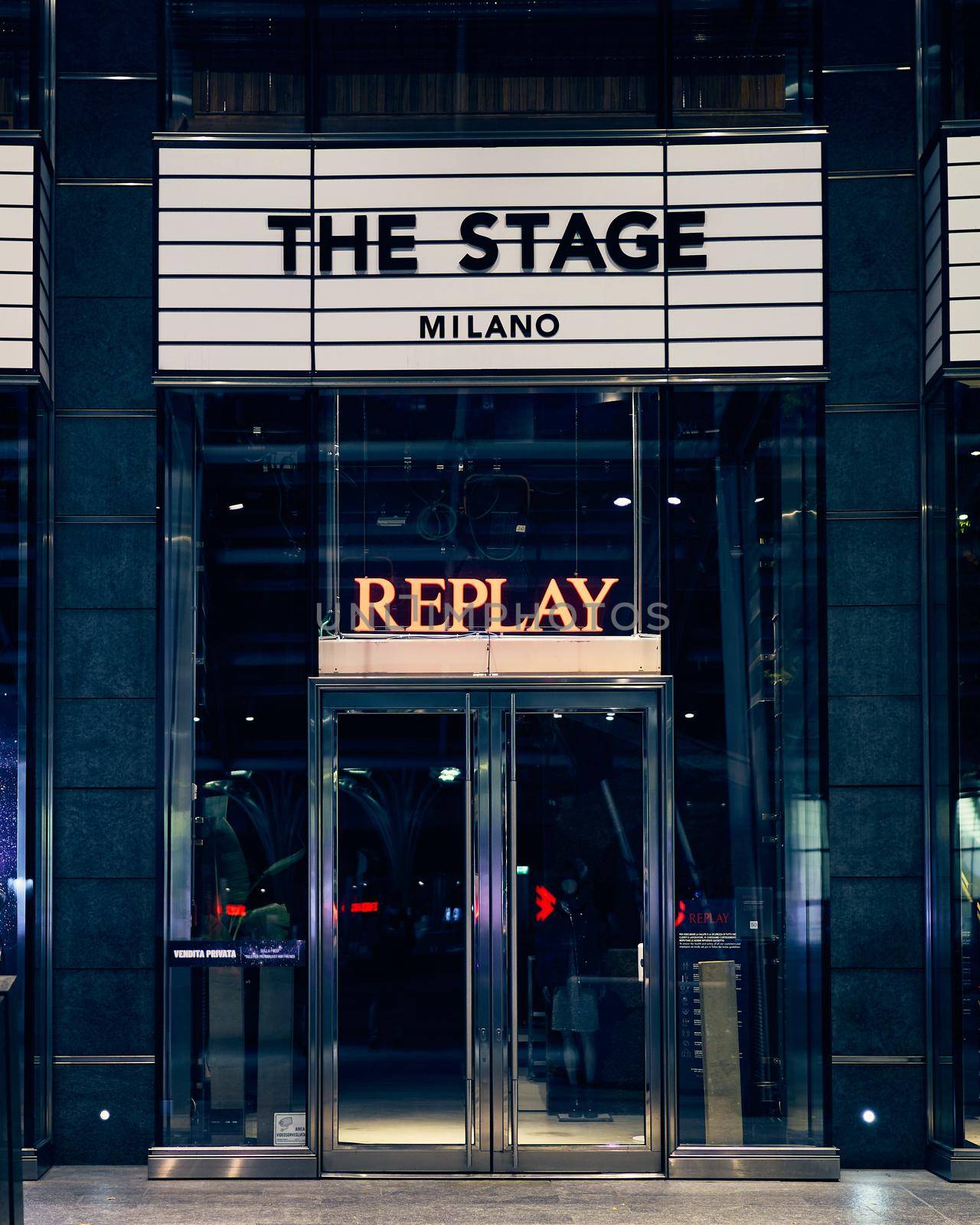 Milan, Italy - 17.12.2020. Replay shop front and logo signboard over the entrance of the store. Replay is fashion clothing store, italian fashion company founded in 1978.