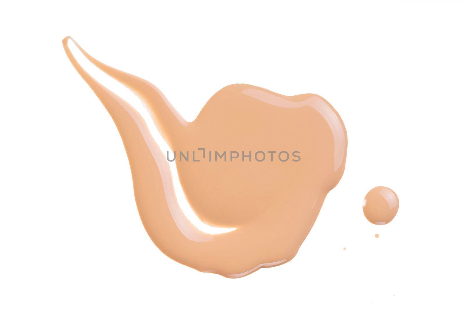 Makeup tone cream swatch isolated on white. Beige liquid foundation, concealer smear smudge drop. Cosmetic liquid foundation, concealer or moisturizer. Nude cosmetic BB cream sample. Macro, from above