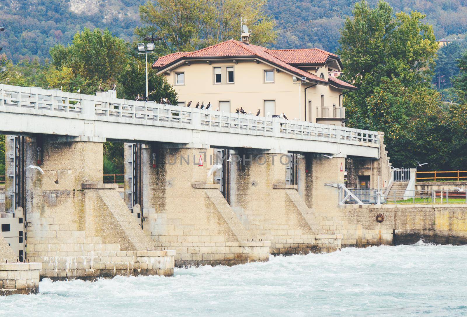 Italian dam - Diga di Olginate - divides the lakes Garlate and Olginate, regulates the Lake Como level and distribute outflows between the irrigation and hydroelectric utilities located downstream.