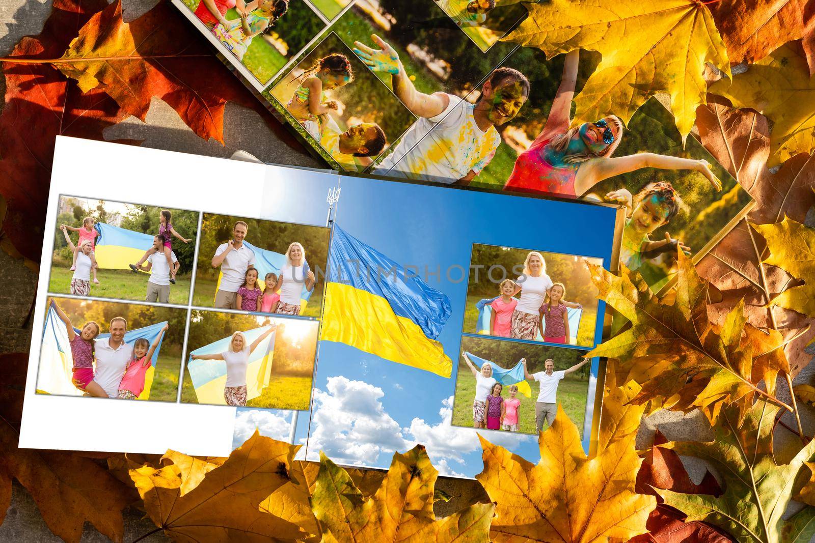 Photobook on the leaves background, closeup of photobook, family photo album