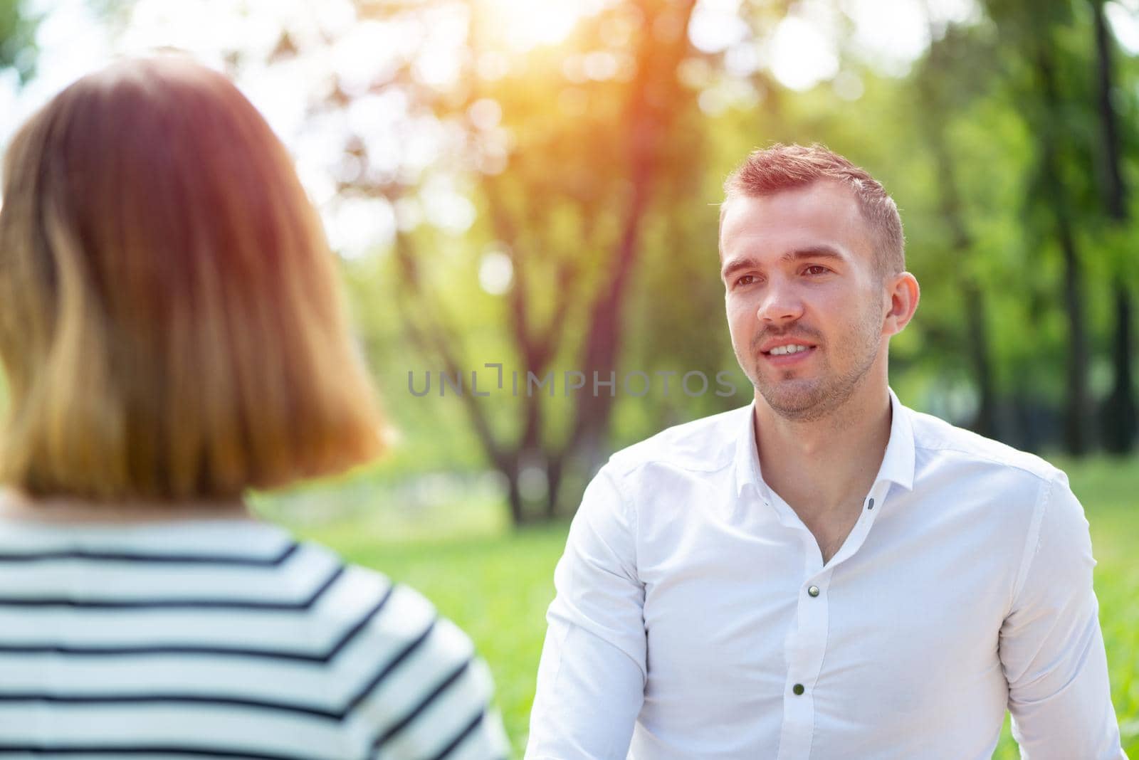 Couple with a dog in the park by adam121