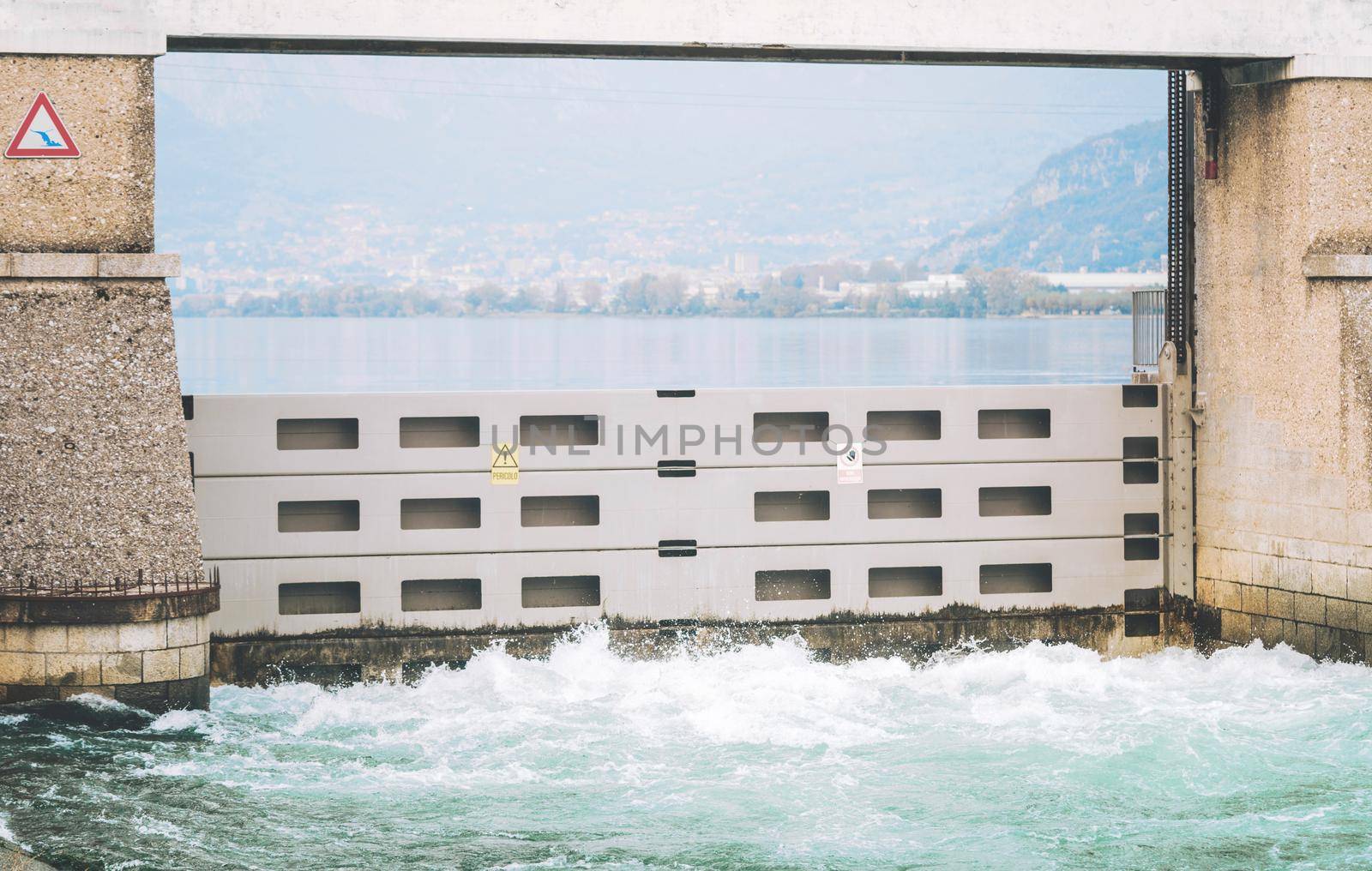 Italian dam - Diga di Olginate - divides the lakes Garlate and Olginate, regulates the Lake Como level and distribute outflows between the irrigation and hydroelectric utilities by photolime