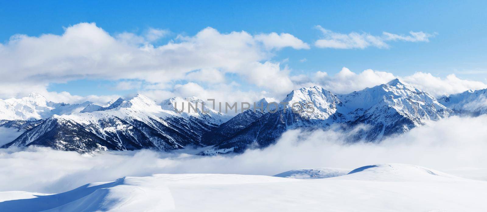 Panoramic view of mountains near Brianson, Serre Chevalier resort, France. Ski resort landscape on clear sunny day. Mountain ski resort. Snow slope. Snowy mountains. Winter vacation. Panorama, banner.