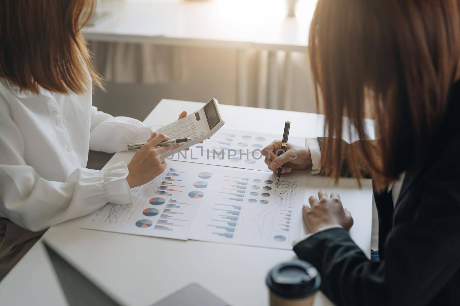 Business People Meeting to analyse and discuss and brainstorming the financial report chart data in office Financial advisor teamwork and accounting concept.