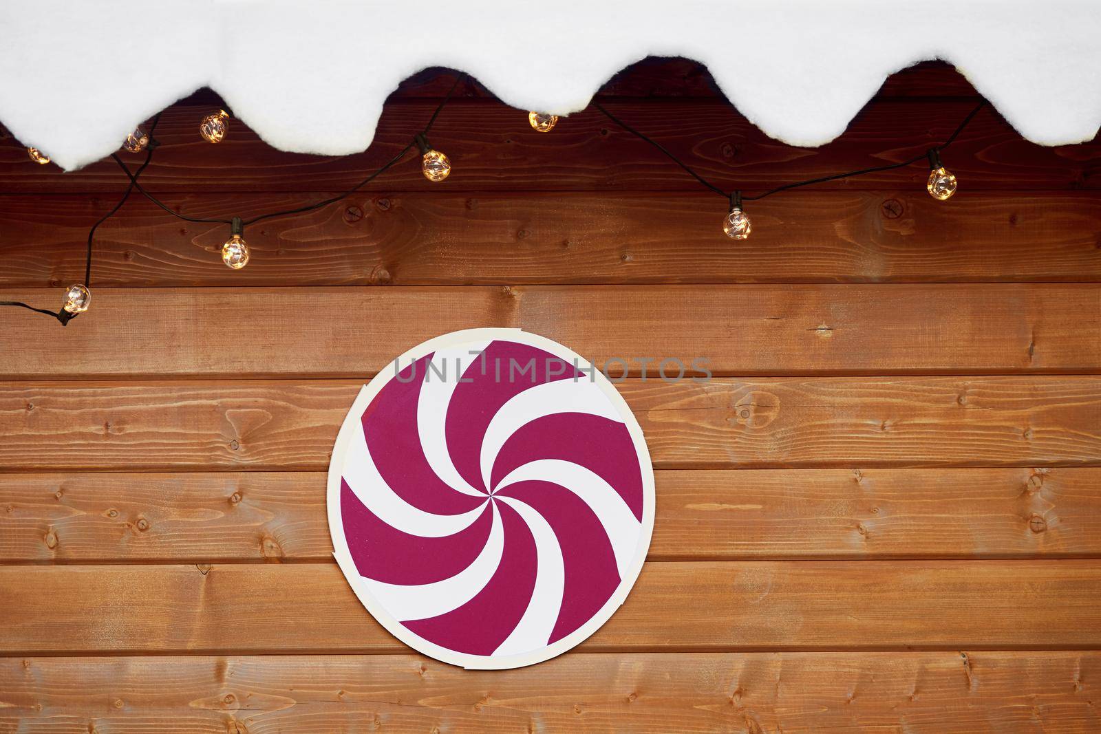 Decorated wall of wooden house with christmas decorations