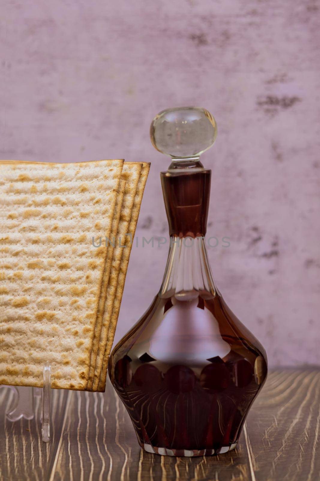 Ceremony of Jewish holiday traditional ritual on Passover celebration in matzah bread with kosher wine