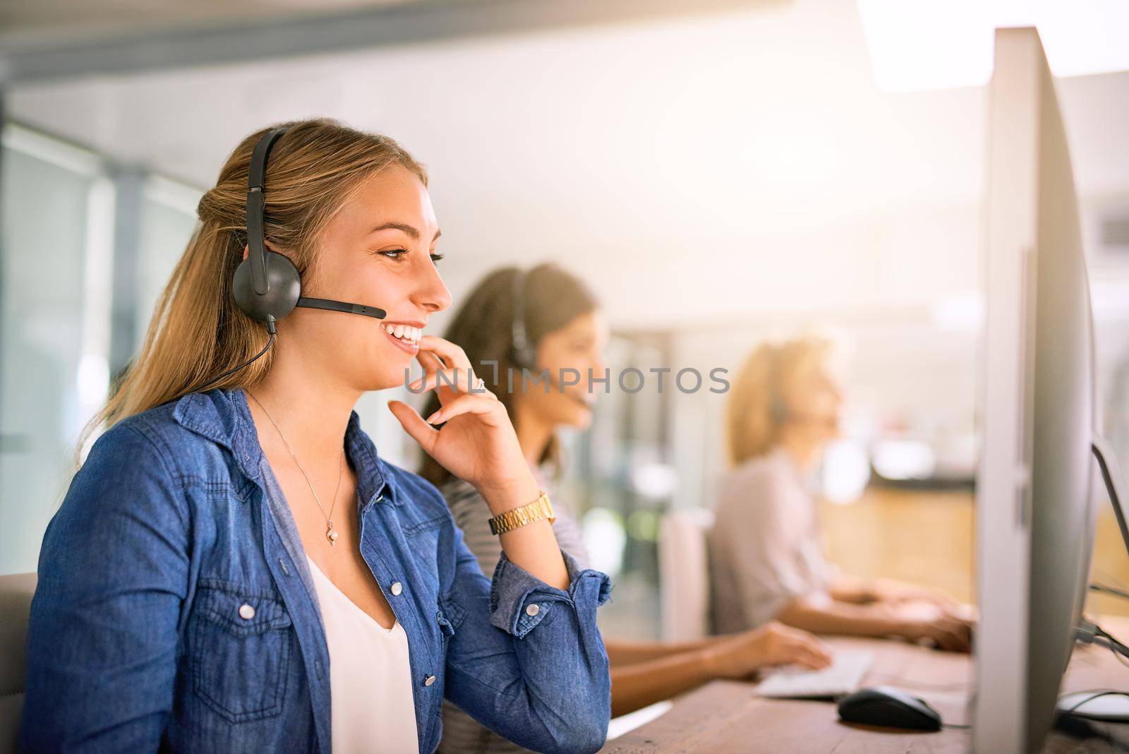 Cropped shot of a group of young women working in a call center.
