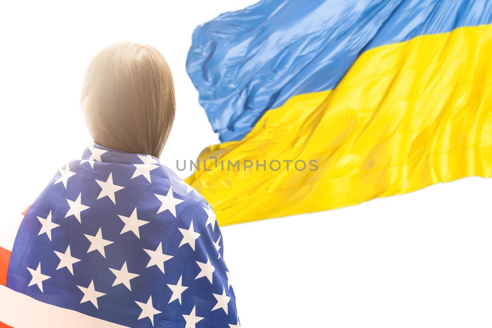 little girl with usa flag on the background of the Ukrainian flag.