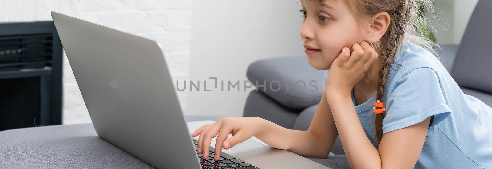 little girl studying with computer, little girl with laptop online