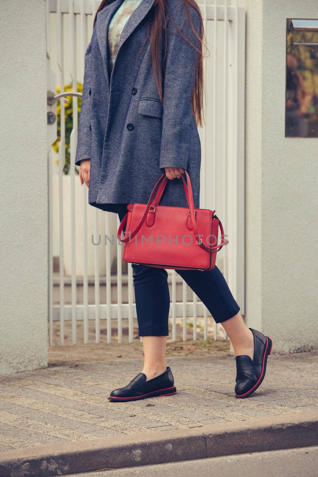 Female fashion concept. Outdoor portrait of a young beautiful business woman posing on the street. Model wearing stylish clothes. by Ashtray25