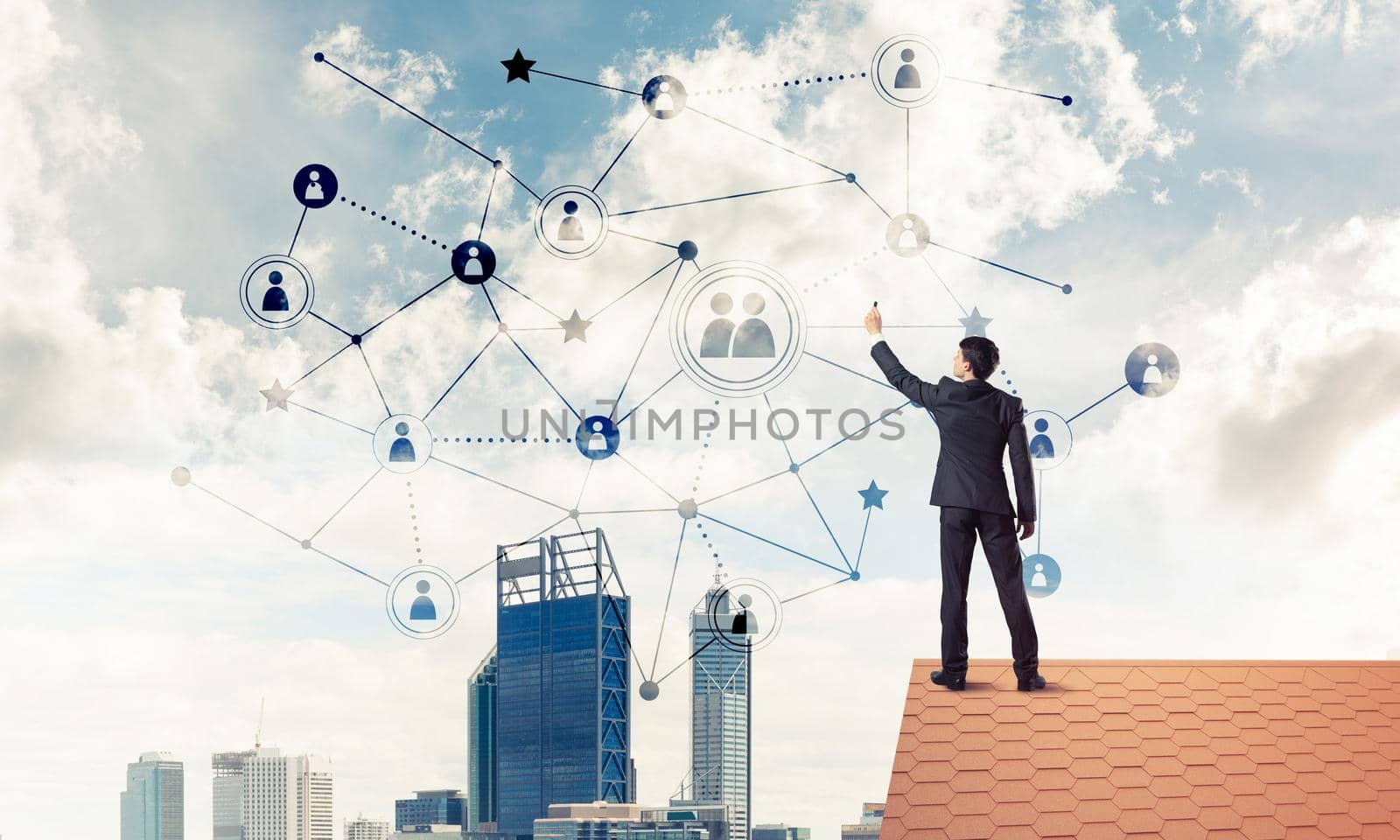 Businessman on house roof presenting networking and connection c by adam121