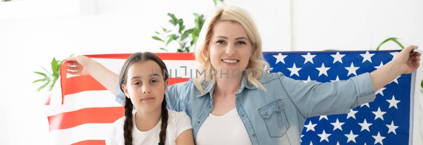 Mother and daughter with American Flag. by Andelov13